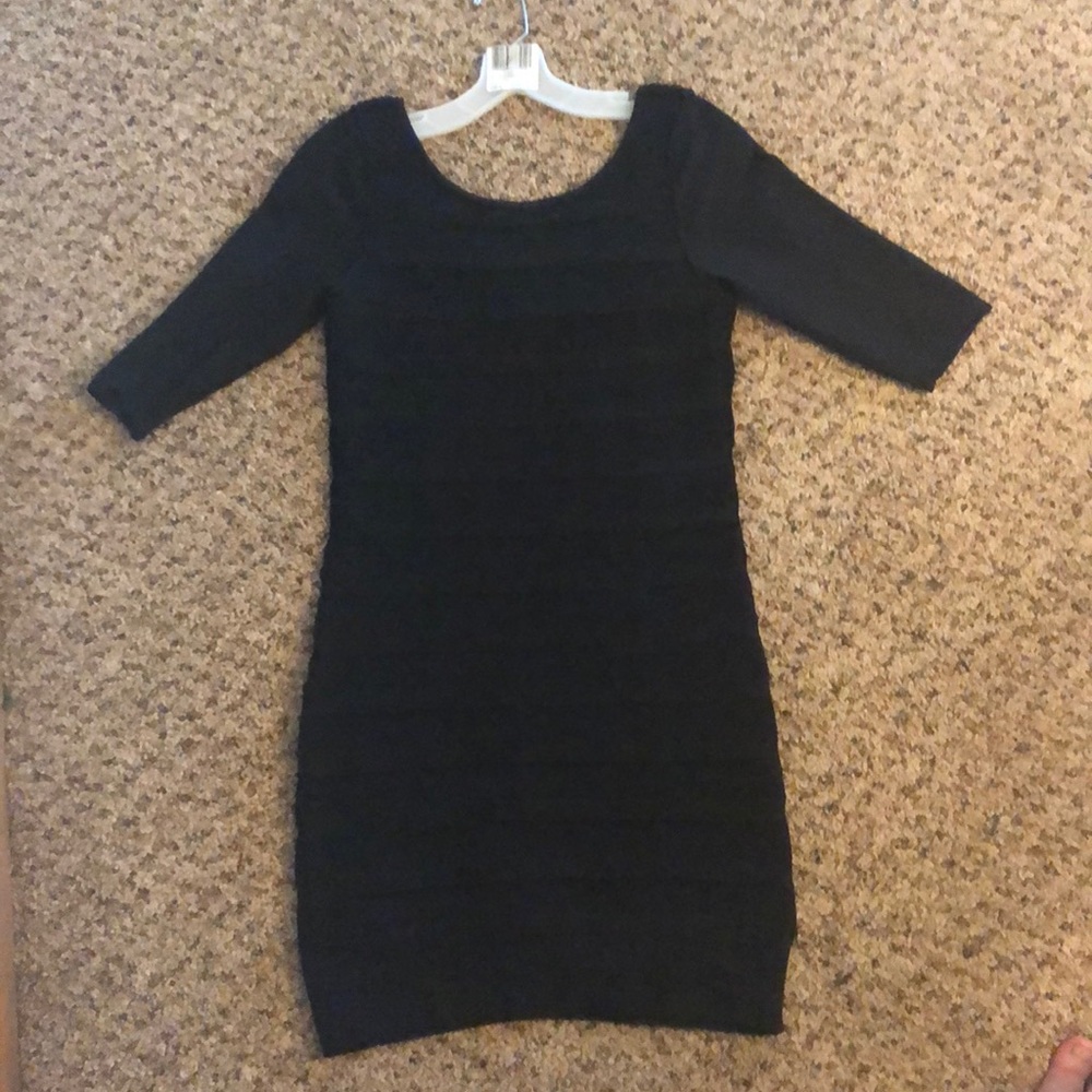 Black, bodycon dress. 3/4 sleeve